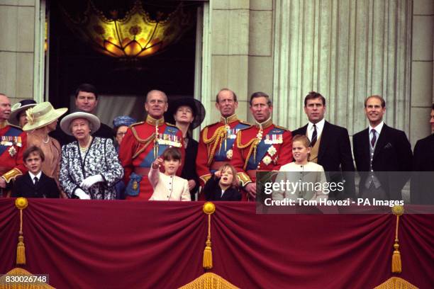 Members of the Royal Family watch the traditional fly-past from the balcony of Buckingham Palace following the Trooping of the Colour in honour of...