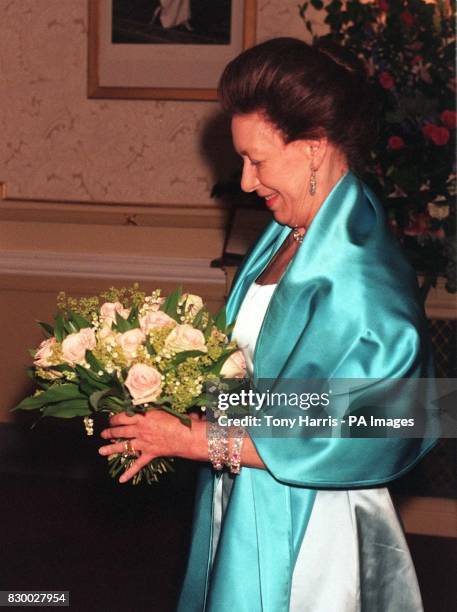 Princess Margaret smiles after being presented with a bouquet of pink roses, at the Gala Performance of the English National Ballet's presentation of...