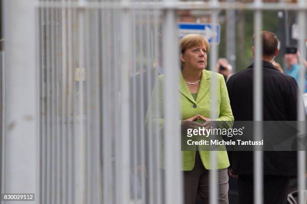 German Chancellor Angela Merkel visits the former prison of the East German, communist-era secret police, or Stasi, at Hohenschoenhausen on August...