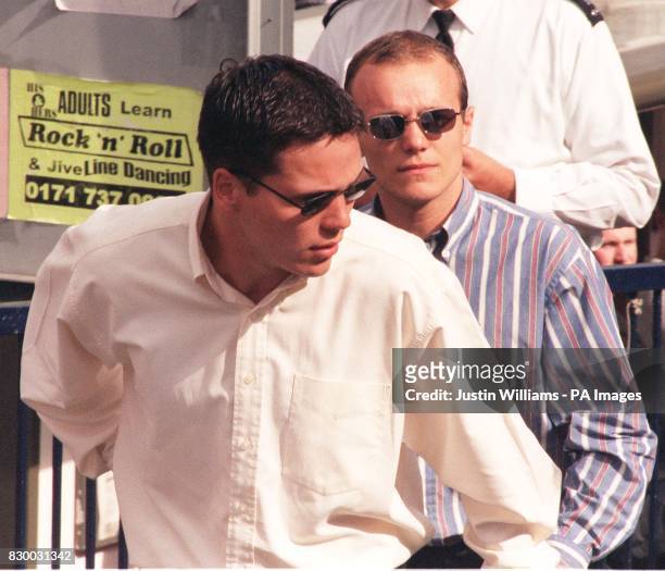 Brothers Jamie and Neil Acourt, followed by other suspects originally arrested for the murder of black teenager Stephen Lawrence, arrive at the...