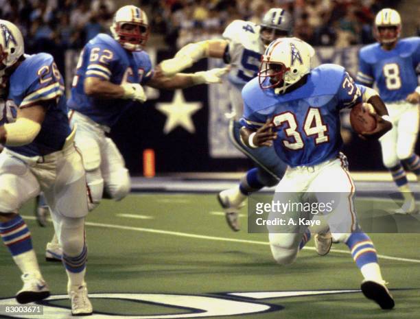 Running back Earl Campbell of the Houston Oilers looks for room to run in a 31 to 34 pre-season loss to the Dallas Cowboys on .