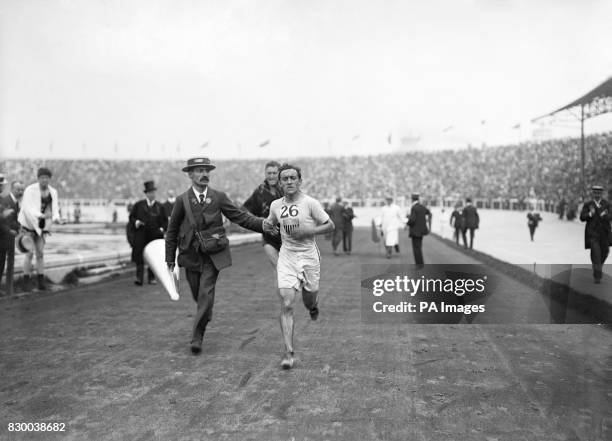 On this day in 1896, the first modern Olympics began in Athens. Pictured here is the American athlete Johnny Hayes, who is competing in the marathon...