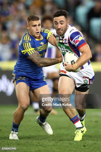 Brock Lamb of the Knights breaks away during the round 23 NRL match between the Parramatta Eels and the Newcastle Knights at ANZ Stadium on August...
