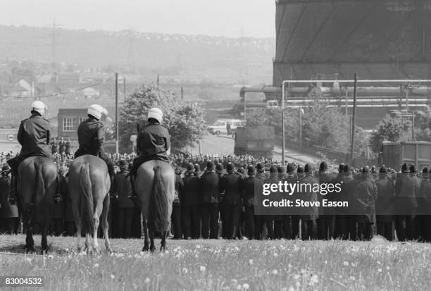 Large numbers of police are deployed at Orgreave Colliery, South Yorkshire, during a picket by striking miners, 30th May 1984.