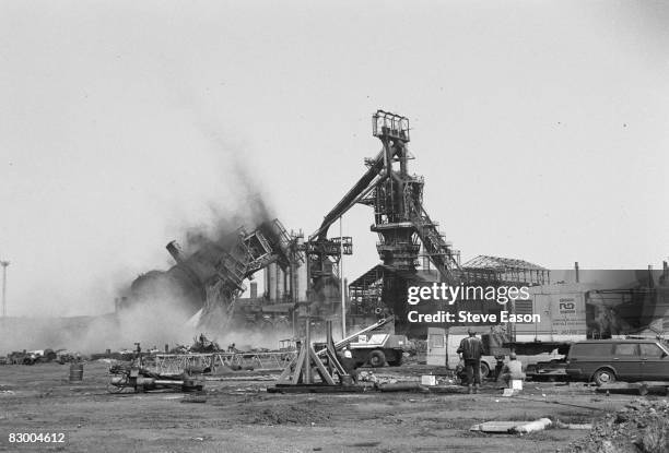 Disused blast furnace is demolished, Teeside, April 1988. Steel production was later transferred to a major complex at Redcar, which is itself...