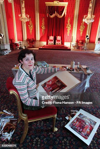 Artist Alison Pullen putting the finishing touches to her paintings of Buckingham Palace interiors which will be used on the Underground to advertise...