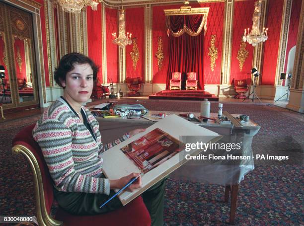 Artist Alison Pullen putting the finishing touches to her paintings of Buckingham Palace interiors which will be used on the Underground to advertise...