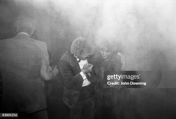 Guests leave the Grand Hotel in Brighton, after a bomb attack by the IRA, 12th October 1984. British Prime Minister Margaret Thatcher and many other...