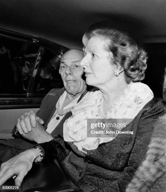 British Prime Minister Margaret Thatcher and her husband Denis leave the Grand Hotel in Brighton, after a bomb attack by the IRA, 12th October 1984....