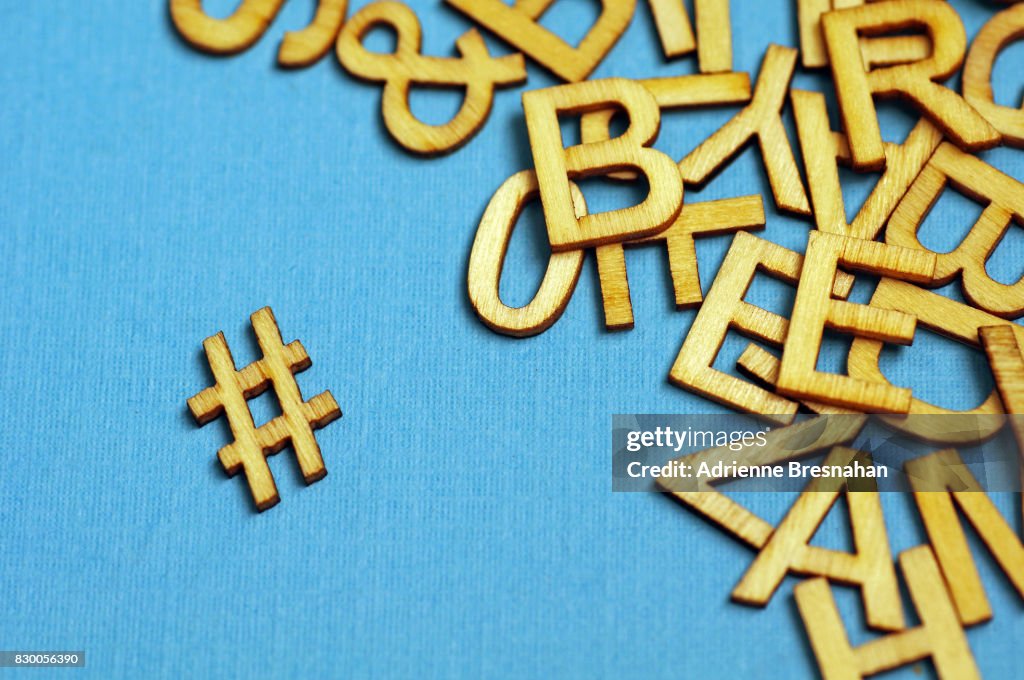 Wooden Hashtag Symbol And Jumbled Letters