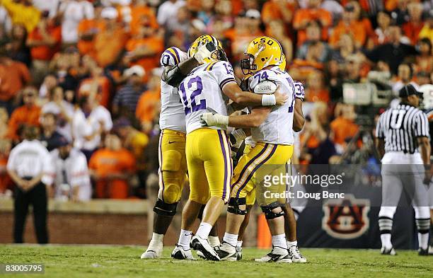 Quarterback Jarrett Lee of the LSU Tigers is congratulated after throwing a touchdown pass to wide receiver Brandon LaFell late in the game against...
