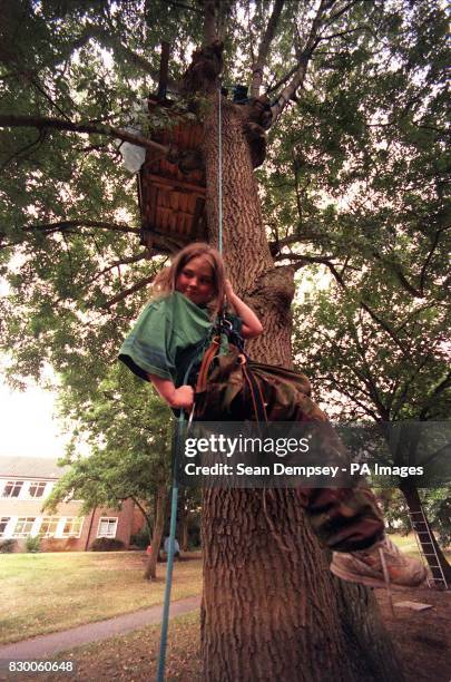 Matthew Williams descends from his tree house at the Silver Birches site in Epsom, Surrey, today . Eleven-year-old Matthew, also known as General...