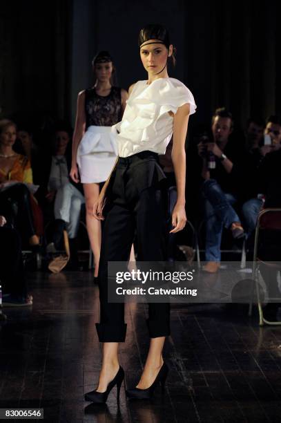 Model walks the runway wearing the Ana Sekularac Spring/Summer 2008/2009 collection during London Fashion Week on September 17, 2008 in London,...