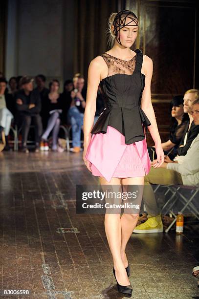 Model walks the runway wearing the Ana Sekularac Spring/Summer 2008/2009 collection during London Fashion Week on September 17, 2008 in London,...