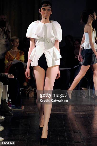 Model walks the runway wearing the Ana Sekularac Spring/Summer 2008/2009 collection during London Fashion Week on September 17, 2008 in London,...