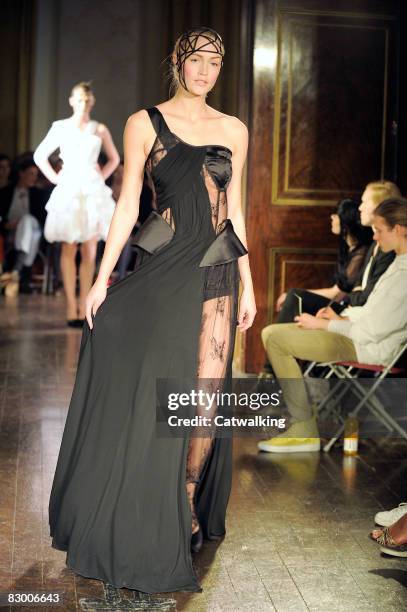 Model walks the runway wearing the Ana Sekularac Spring/Summer 2008/2009 collection during London Fashion Week on September 17, 2008 in London,...