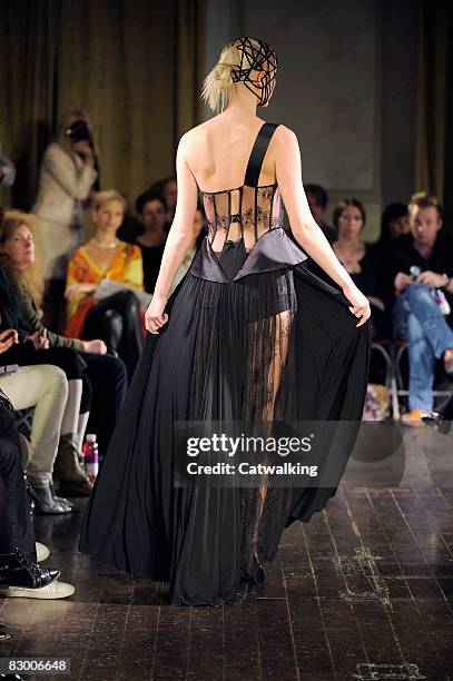 Model walks the runway wearing the Ana Sekularac Spring/Summer 2008/2009 collection during London Fashion Week on September 17, 2008 in London,...