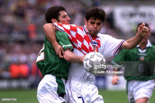 Croatia's Aljosa Asanovic, shields the ball from Ireland's Denis Irwin, during this afternoon's European Championship qualifier at Lansdowne Road in...