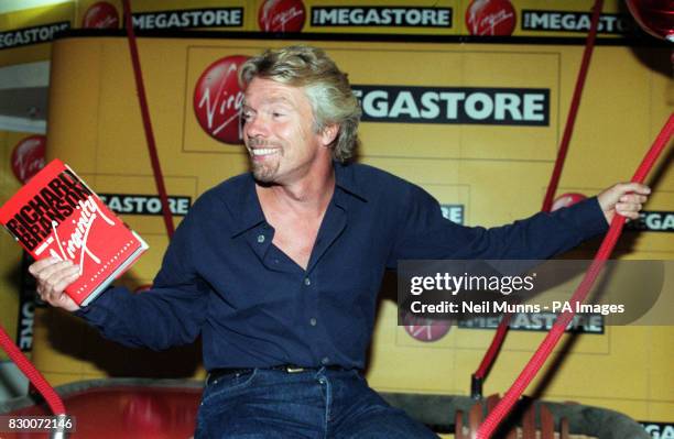 Virgin Boss/adventurer Richard Branson sits in a balloon basket at Virgin Megastore in London today , where he signed copies of his new book, Losing...