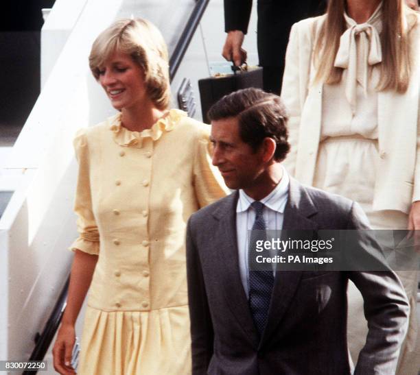 PA NEWS PHOTO 11/5/83 THE PRINCE AND PRINCESS OF WALES ARRIVE AT HEATHROW AIRPORT AFTER A TEN DAY HOLDAIY IN THE BAHAMAS. THE HOLIDAY FOLLOWED THEIR...