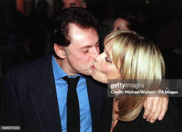 TWIGGY RECEIVES A KISS FROM HER HUSBAND LEIGH LAWS AS THEY ARRIVE FOR THE UK GALA PREMIERE OF THE FILM 'EVER AFTER - A CINDERELLA STORY', AT THE...