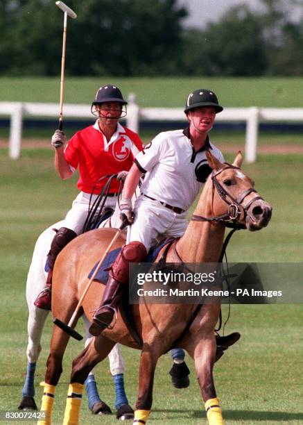 PA NEWS PHOTO 16/7/91 THE PRINCE OF WALES AND MAJOR JAMES HEWITT IN ACTION DURING A POLO MATCH AT THE ROYAL BERKSHIRE POLO CLUB.