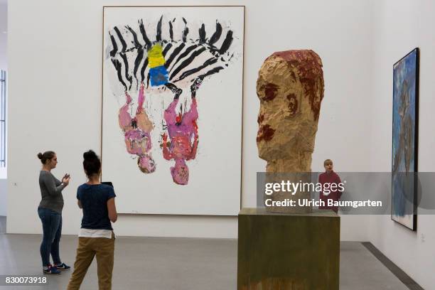 In the Museum Pinakothek der Moderne in Munich. Young people in front of the works of Georg Baselitz - Bedroom 2005 , Finger painting and Diamond...