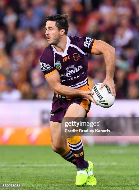 Ben Hunt of the Broncos passes the ball during the round 23 NRL match between the Brisbane Broncos and the Cronulla Sharks at Suncorp Stadium on...