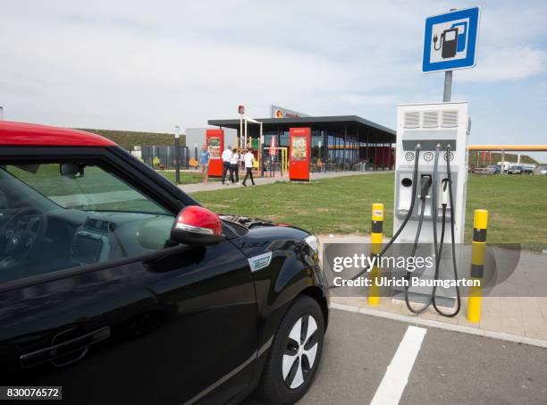 During the lunch break- charging the batteries of an electric car at the roadhouse area Aurach in Bavaria.