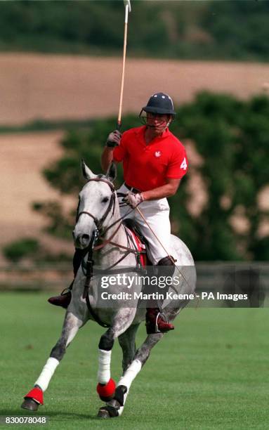 PA NEWS PHOTO 3/8/93 THE PRINCE OF WALES DURING A POLO MATCH PLAYED IN AID OF THE LEONORA CANCER FUND, AT THE ANSTY POLO CLUB, WILTSHIRE. THE FUND...
