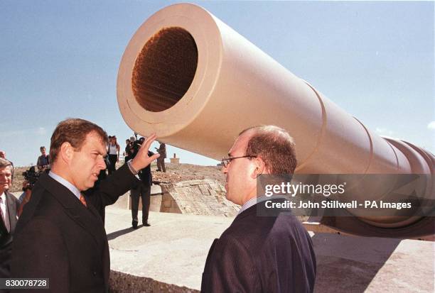 The Duke of York with guide Mario Farrugia, inspects the 100 ton gun at Fort Rinella on the coast near to Valletta, Malta this afternoon. The Duke is...