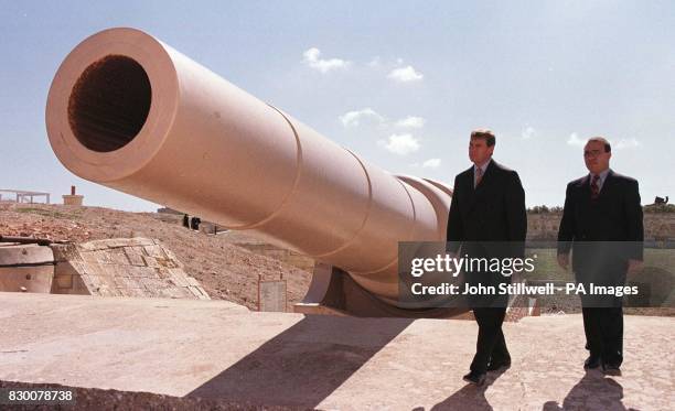 The Duke of York with guide Mario Farrugia, inspects the British built 100 ton gun at Fort Rinella on the coast near to Valletta, Malta this...