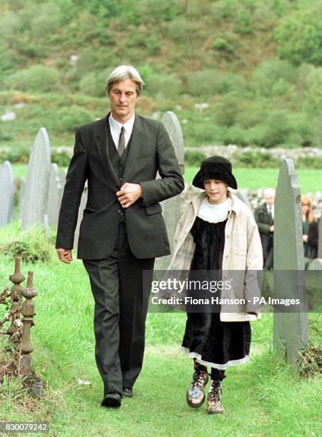 Library filer dated 5/10/96 of Dr Shaun Russell and his daughter Josie walk away from the graveside following the funeral of Lin and Megan Russell,...