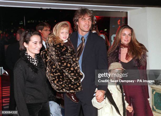 PA NEWS PHOTO 8/10/98 FOOTBALLER DAVID GINOLA AND HIS WIFE CORALINE ARRIVES FOR THE CHARITY PREMIERE OF THE NEW DISNEY FILM "MULAN" IN AID OF THE...