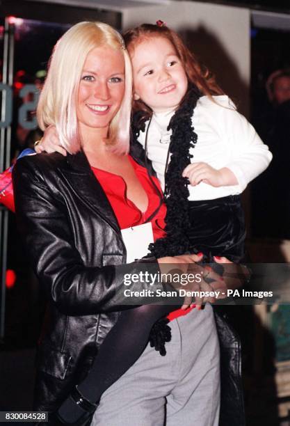 Big Breakfast TV Presenter Denise Van Outen and her god-daughter Elicia Moon Murphy arrive for the Premiere of Disney's film "Mulan" in aid of the...