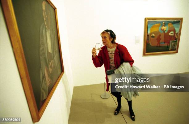 Andree Molyneux, studies Salvador Dali's 'Portrait of an Artists Father' one of the many items on display at the Salvador Dali exhibition at the Tate...