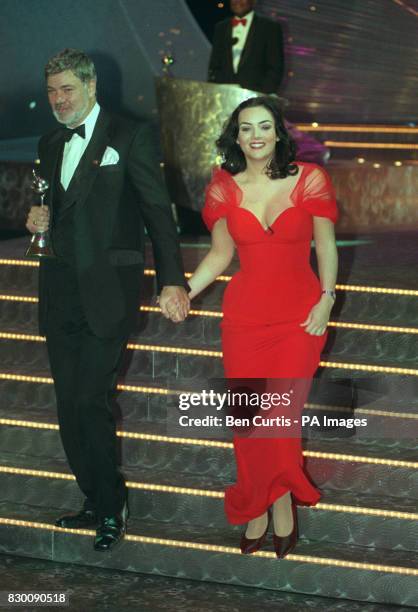 News 27/10/98 Television presenter Matthew Kelly and 'Eastenders' actress Martine McCutcheon leave the stage National Television Awards in the Royal...