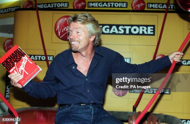 Virgin Boss/adventurer Richard Branson sits in a balloon basket at Virgin Megastore in London today , where he signed copies of his new book, Losing...