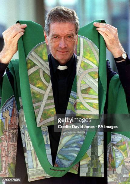 The Venerable John Barton, Archdeacon of Aston, Birmingham, shows off a range of religious stoles that carries a view of the city' notorious motorway...
