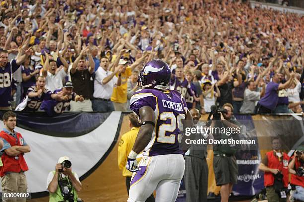 Chester Taylor of the Minnesota Vikings looks into the crowd as they cheer during the NFL game against the Carolina Panthers at the Hubert H....