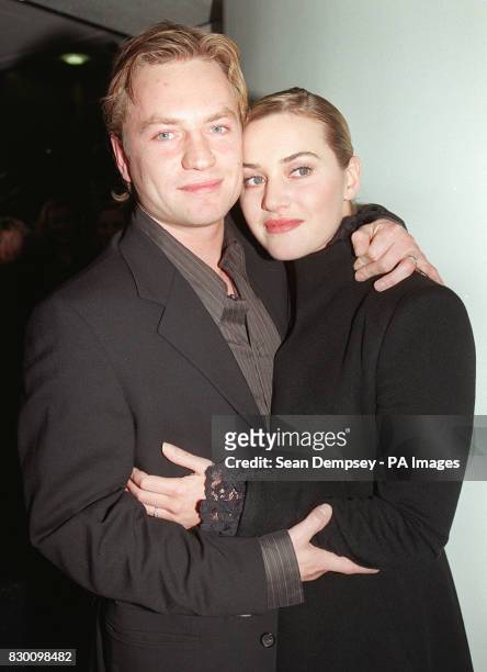'Titanic' star Kate Winslet and fiance Jim Threapleton arrive for tonight's premiere of her new film 'Hideous Kinky', at the Odeon Leicester Square....