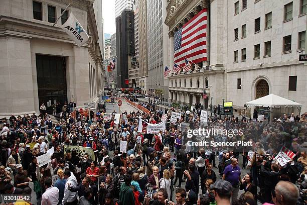 People rally in front of the New York Stock Exchange in the financial district against the proposed government buyout of financial firms September...