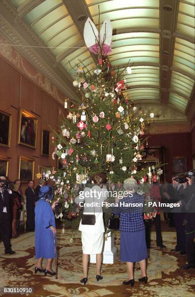 The Princess Royal joins The Queen and Queen Mother , viewing some of the embroidered ornaments on the Queen's Christmas Tree, in the Picture...