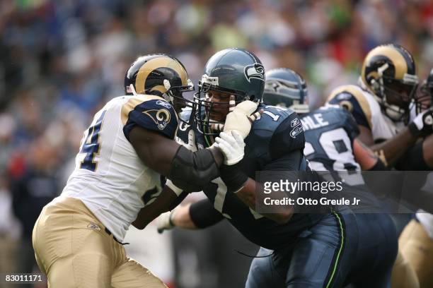 Walter Jones of the Seattle Seahawks blocks Victor Adeyanju of the St. Louis Rams during the game on September 21, 2008 at Qwest Field in Seattle,...
