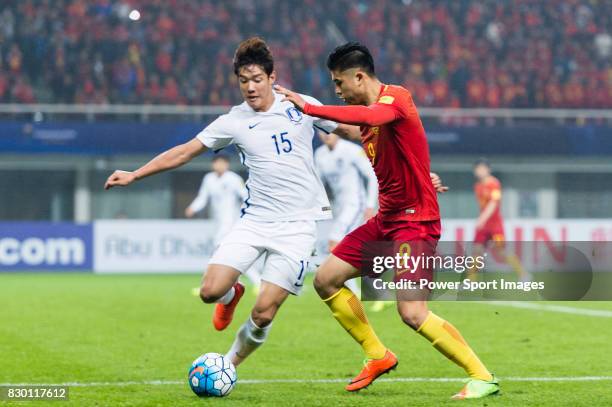 Zhang Yuning of China PR battles for the ball with Hong Jeongho of Korea Republic during their 2018 FIFA World Cup Russia Final Qualification Round...