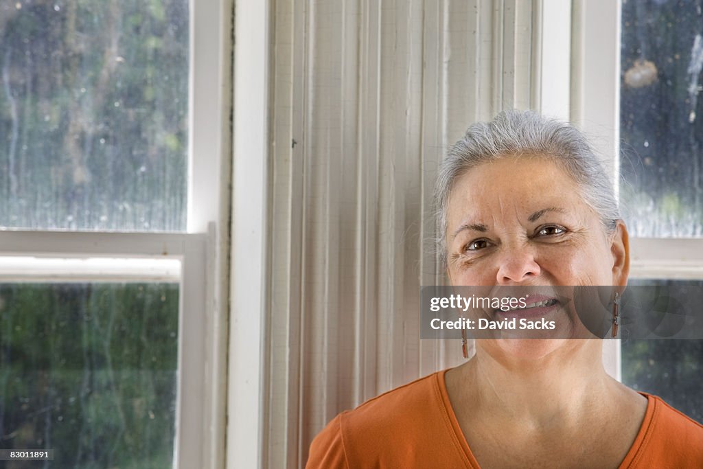 Woman in front of windows