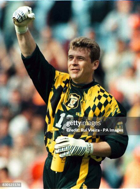 Scotland's Andy Goram celebrates his team's 0-0 draw with Holland after their EURO '96 group match at Villa Park. 26/5/98: Goram quits international...