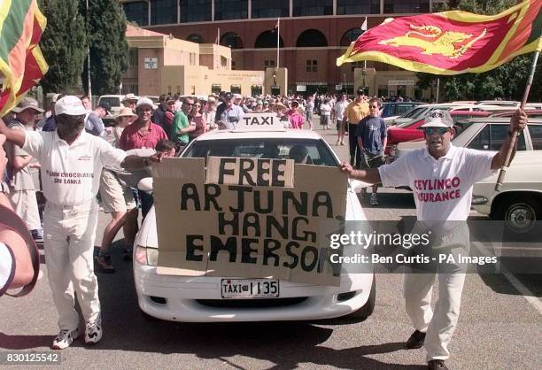 Sri Lankan fans protest the innocence of their captain, Arjuna Ranatunga, as he leaves the disciplinary hearing at the Adelaide Oval by taxi after it...