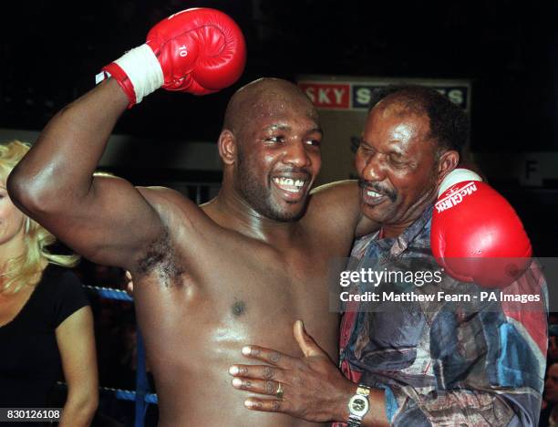 London's Julis Francis celebrates with his father Danny after successfully retaining his British and Commonwealth Heavyweight boxing titles against...