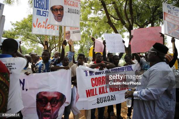 Pro President Muhammadu Buhari supporters are seen during a solidarity rally in Abuja, Nigeria's capital on 11 August 2017. Resume or Resign protest...